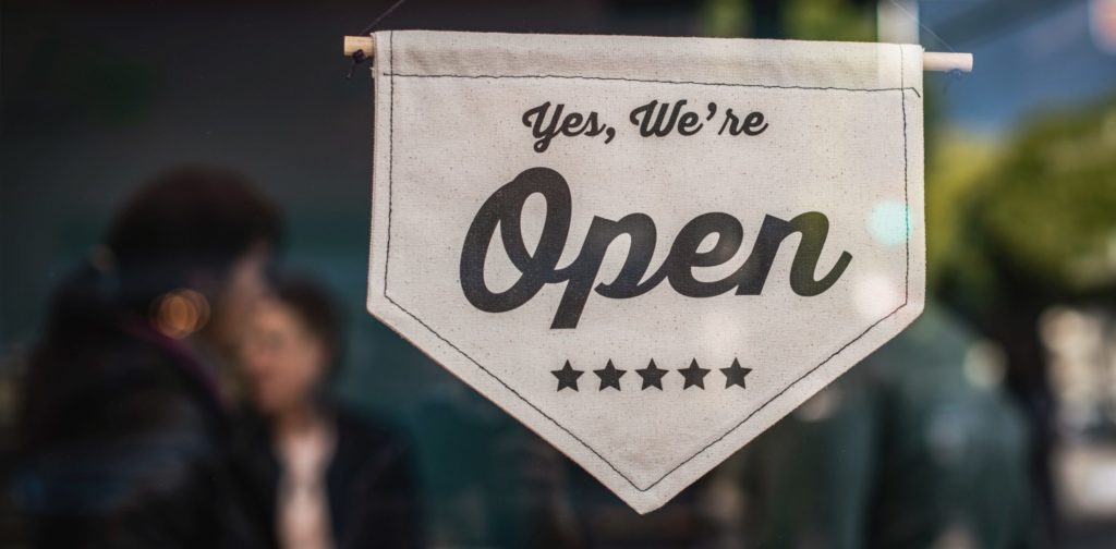 "Yes, We're Open" store sign.